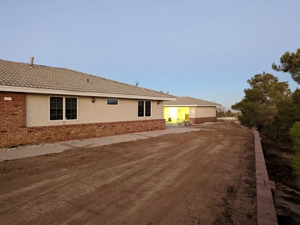 Professional yard maintenance for residential properties in Hesperia, CA by Fast Trac Tractor Service