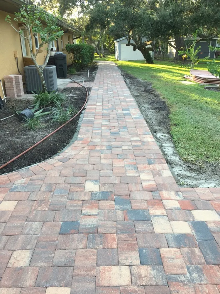 Custom yard cleanup service for homes in Sarasota, FL by Father & Son Pavers and Landscaping