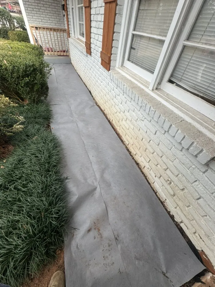 Trusted landscape design in Tucker, GA - Father and son landscaping