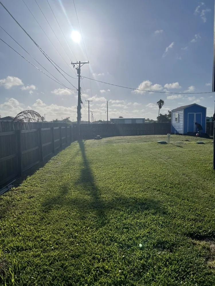 Custom landscape design in Rockport, TX by Father And Sons Lawn Service