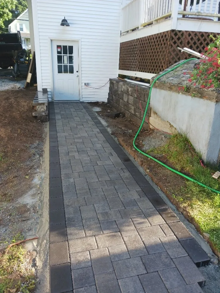 Professional yard cleanup service for outdoor upgrades in Waltham, MA by Fernandez Landscaping