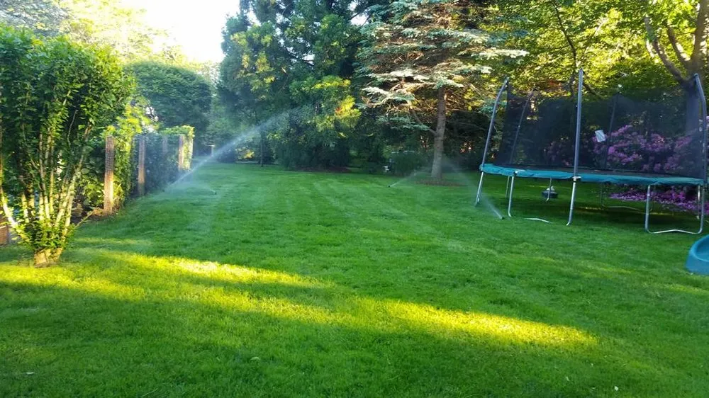 Custom lawn mowing service with custom design in Watermill, NY by Fernando's Home Improvement