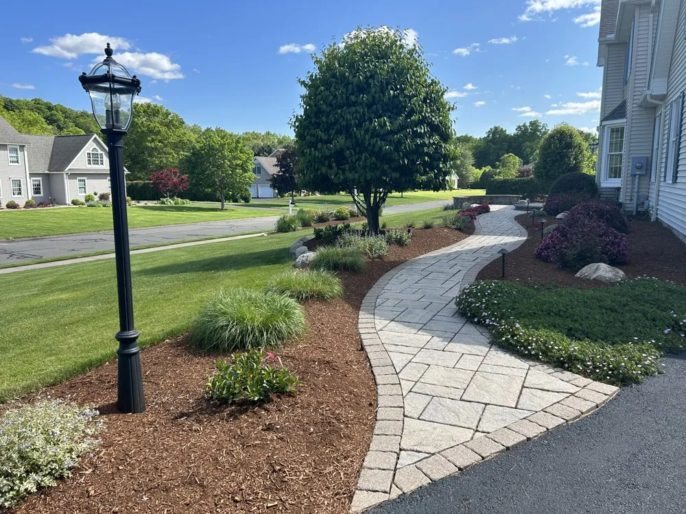 Custom outdoor landscaping with custom design in Suffield, CT by Ferrari Lawn & Landscape