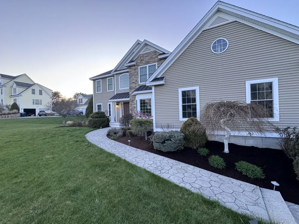 Affordable lawn mowing service for residential properties in Stratham, NH by Field Day Builders