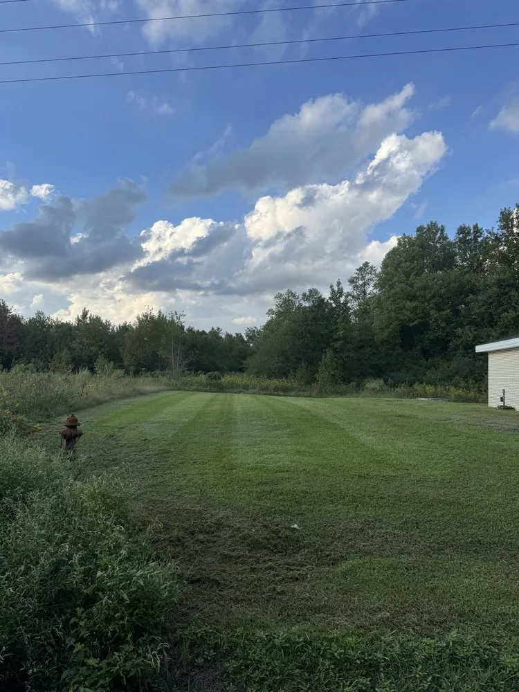Professional lawn mowing service for residential properties in Jacksonville, NC by Fine Line Landscaping