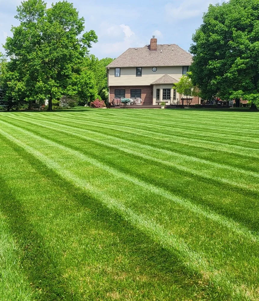 Custom landscape installation with custom design in Fishers, IN by Fine Touch Services