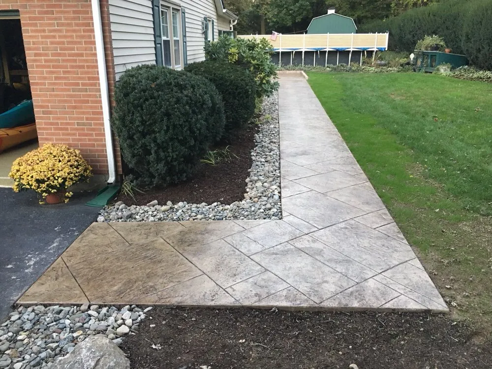 Custom landscape design for year-round maintenance in Zionsville, PA by Finishing Edge
