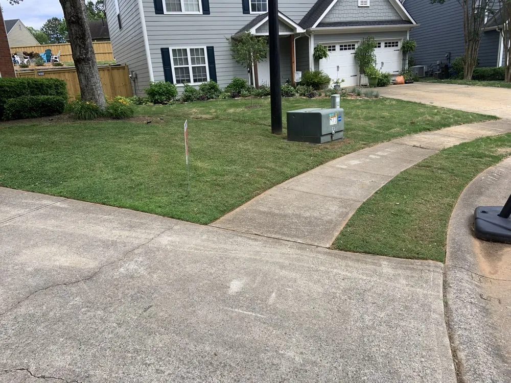 Custom landscape installation for residential properties in Decatur, GA by First & Goal