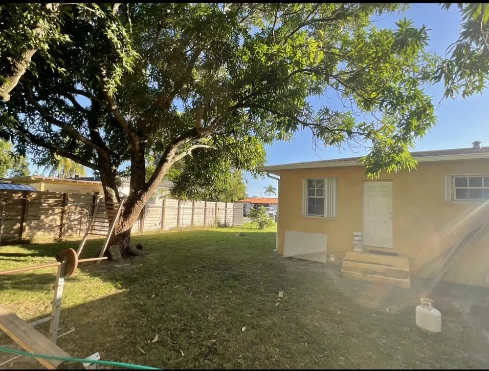 Professional yard cleanup service for year-round maintenance in Miami Shores, FL by First Choice Landscaping