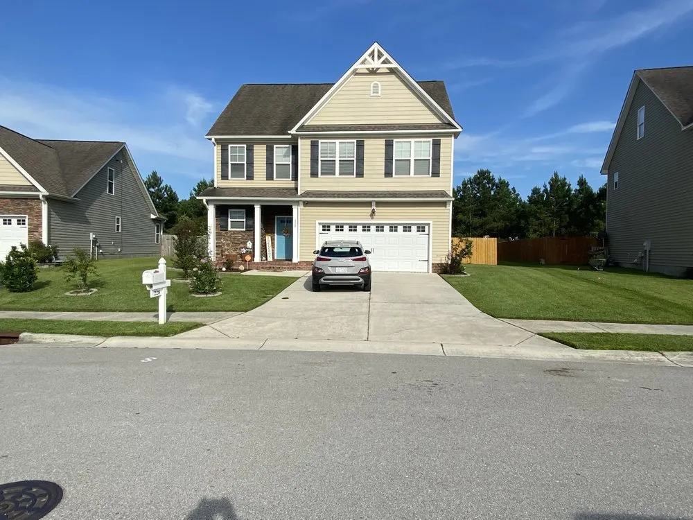 Trusted lawn mowing service for beautiful yards in Laurinburg, NC by First Class Lawnservice