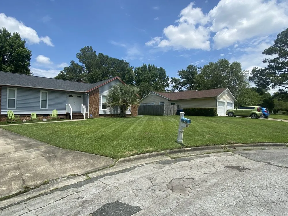 Custom lawn mowing service in Laurinburg, NC by First Class Lawnservice