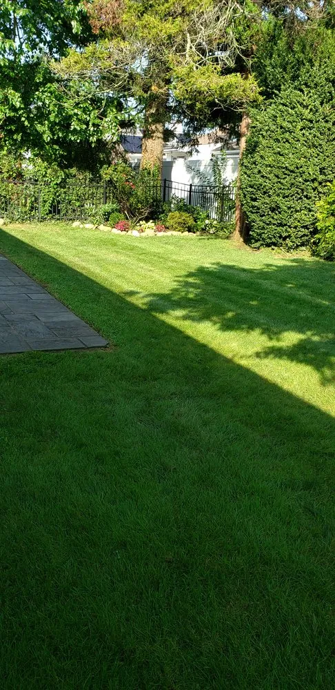 Top-rated lawn mowing service for residential properties in Woodmere, NY by First in class landscape