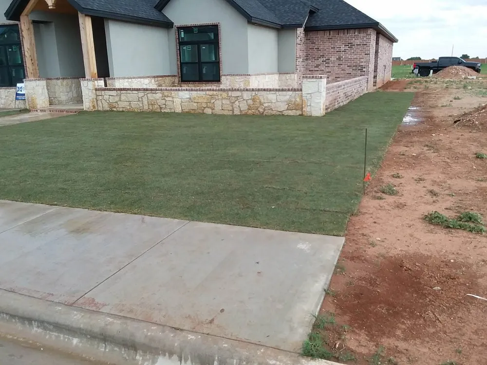 Expert lawn mowing service for residential properties in Lubbock, TX by First Shot Solutions