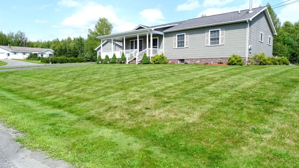 Custom landscape design for residential properties in Caribou, ME by Flat Fee Plowing & Property Services