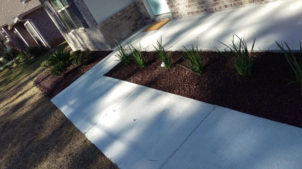 Trusted lawn mowing service with custom design in Cantonment, FL by Flextreme Surfaces