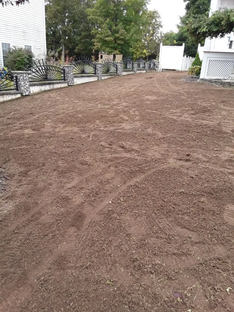 Local lawn care service with custom design across Randolph, MA - Flores Landscaping Services