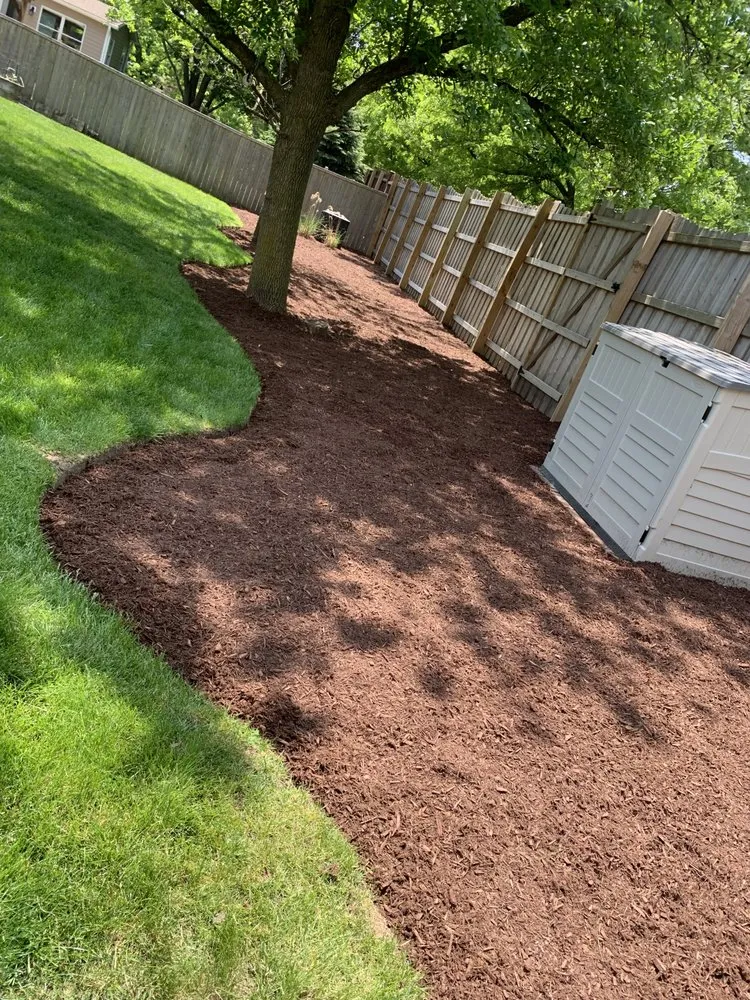 Local landscape installation for year-round maintenance in Aurora, IL by Flowers Landscaping