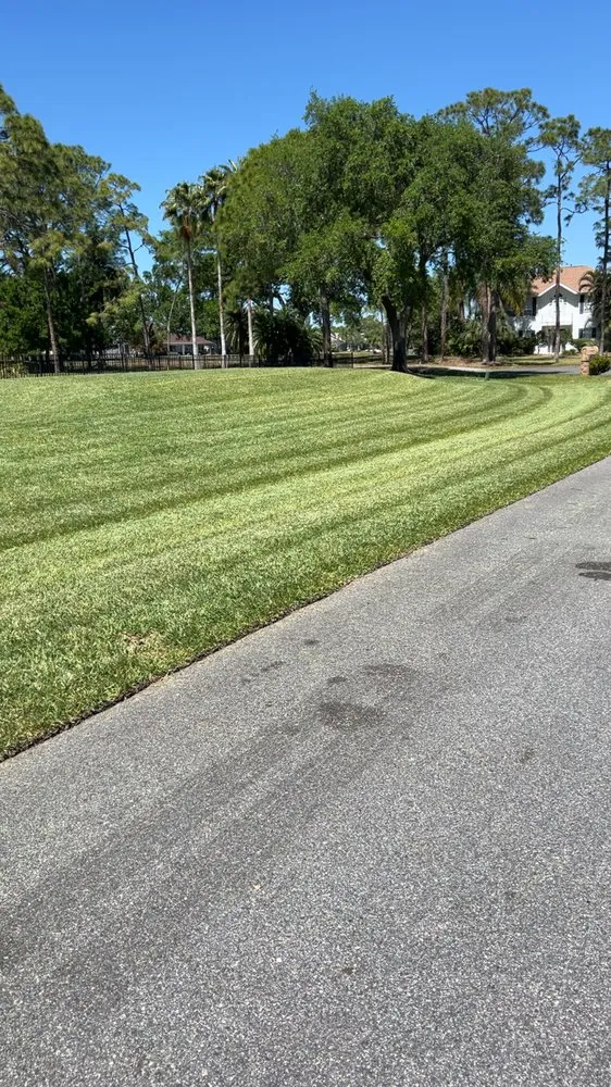 Professional lawn mowing service in Palm Bay, FL by Fluorescent Lawn Care