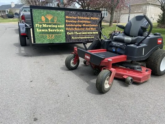 Fly Mowing And Lawn Services Logo