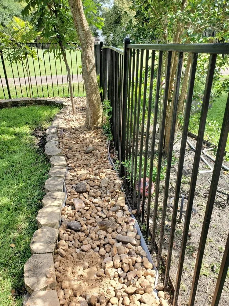 Custom landscape design for residential properties in Rosharon, TX by Fort Bend Construction and Grounds