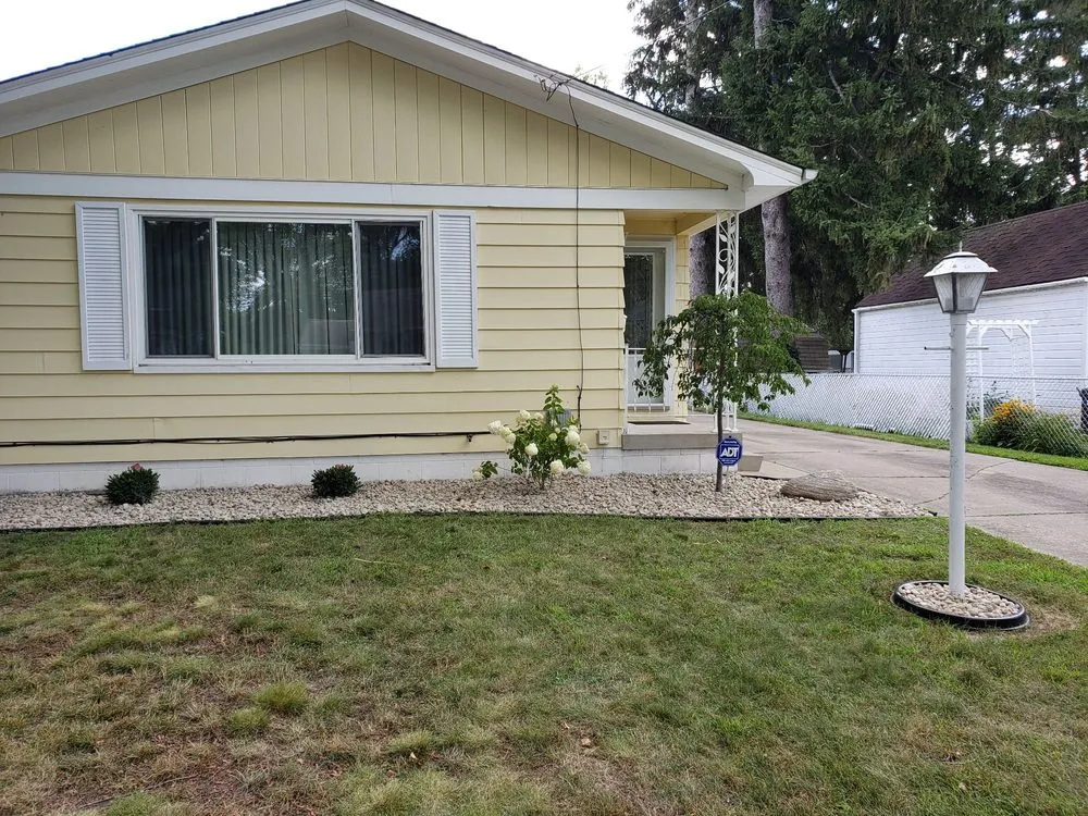 Expert lawn care service for homes in Saginaw, MI by Fosters Development