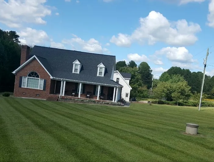 Expert landscaping services for homes in Louisburg, NC by Foster’s Lawn Maintenance and Landscaping