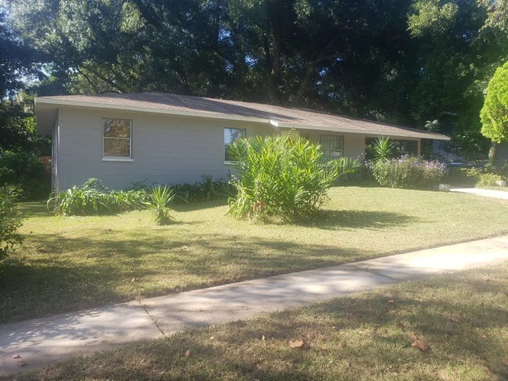 Professional lawn care service for residential properties in Gainesville, FL by Freenys Lawn Service