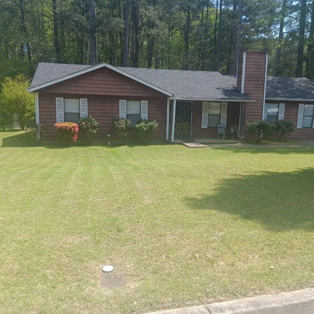 Professional lawn mowing service for homes in Jonesboro, GA by Fresh Cut and Hauling
