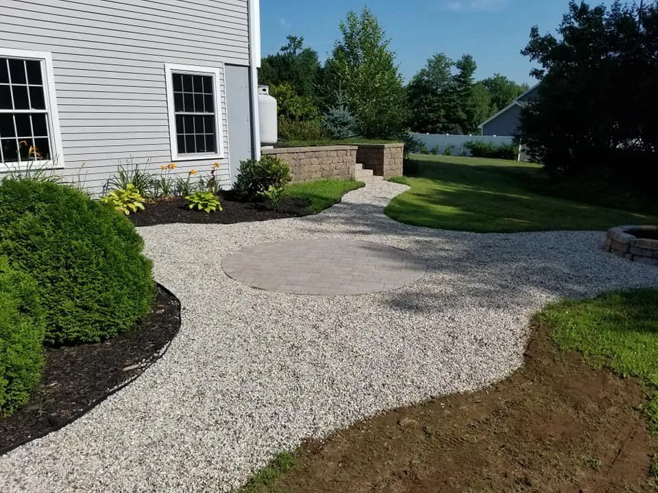 Custom lawn mowing service for year-round maintenance in Auburn, ME by Fresh Start Landscape