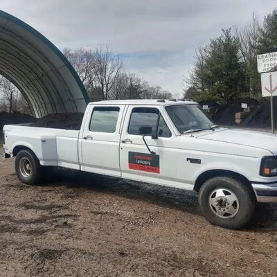 Friendly Brinleys Landscaping Logo