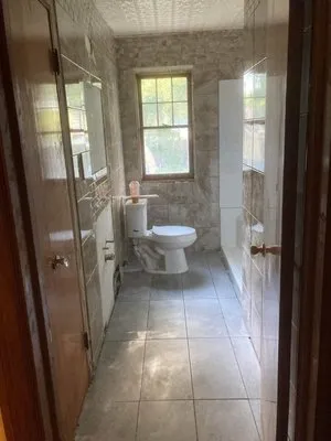 Friendly Neighbors Handyman and Landscaping Logo