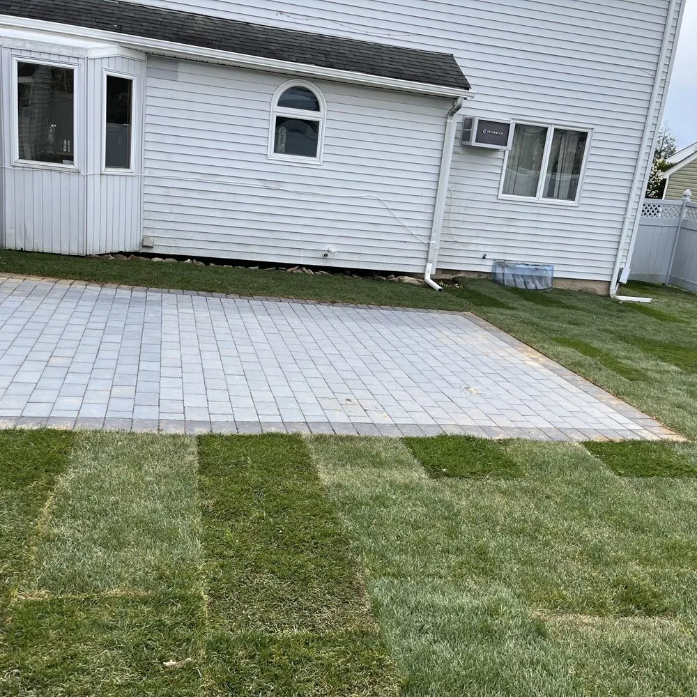 Custom yard cleanup service for year-round maintenance in Brentwood, NY by G Flores Landscaping
