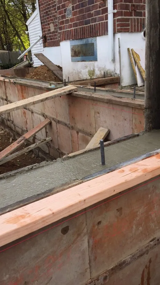 Affordable lawn mowing service for residential properties in Commack, NY by Gabriella Concrete