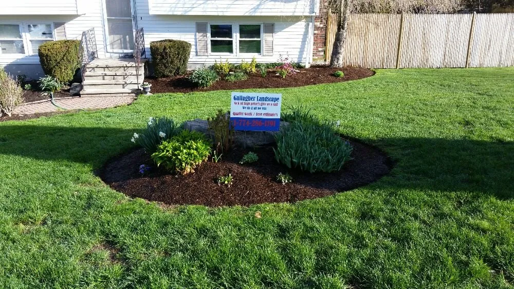 Local lawn mowing service with custom design in Natick, MA by Gallagher Landscaping