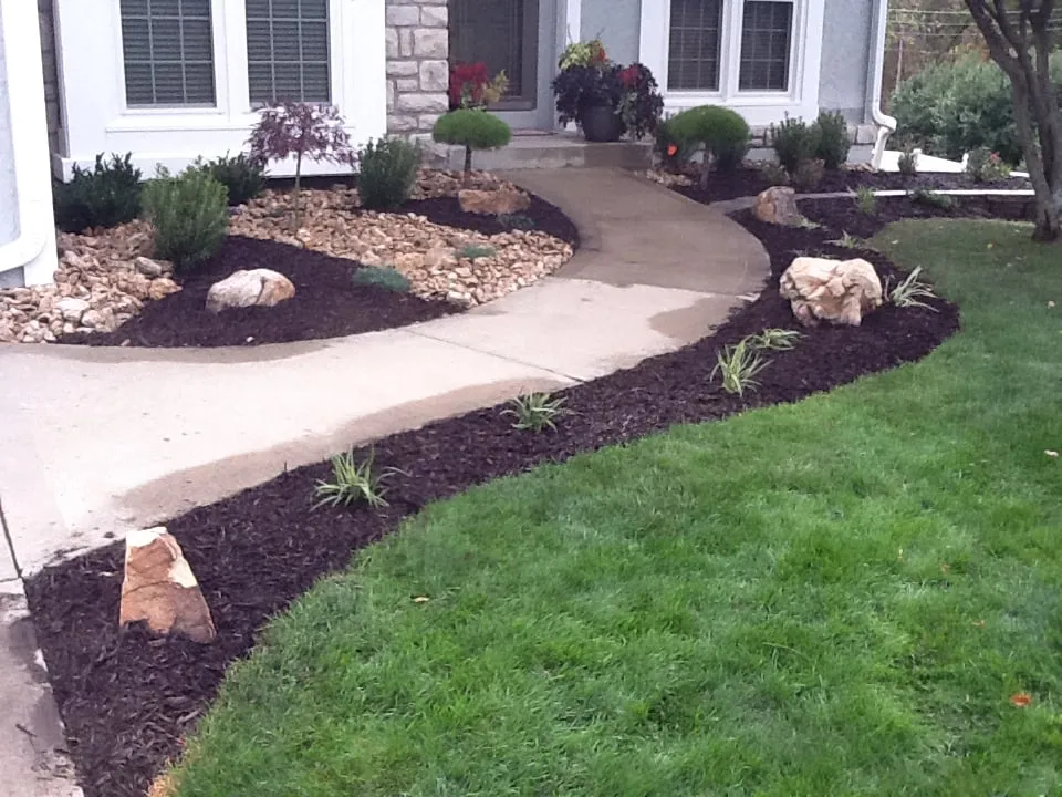 Custom garden landscaping in Raymore, MO by Garden Gate Lawn & Landscape