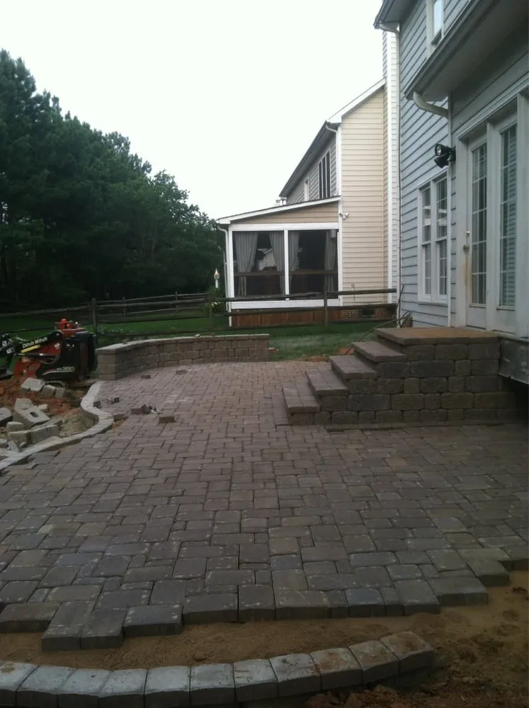 Custom outdoor landscaping for residential properties in Huntersville, NC by Garden Grove