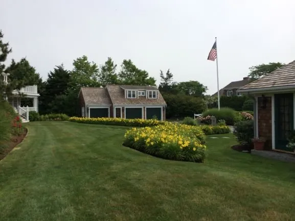 Custom outdoor landscaping for year-round maintenance across East Falmouth, MA - Gardens By Barbara Conolly
