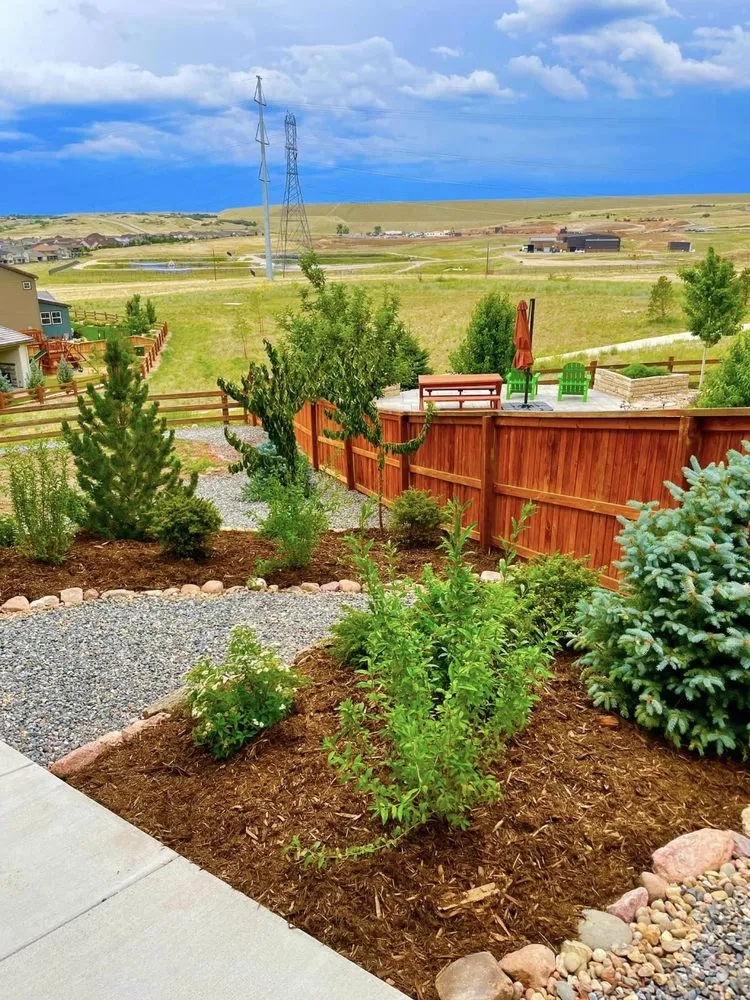 Custom landscape installation for year-round maintenance in Highlands Ranch, CO by Gardens In Bloom Landscaping