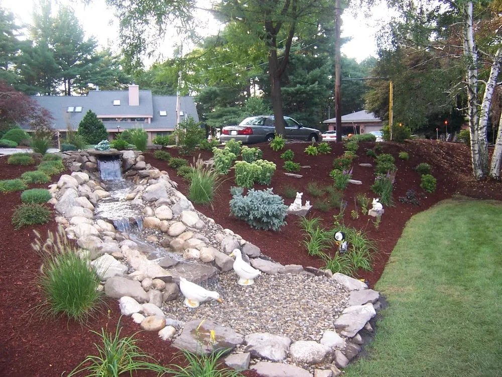 Custom lawn mowing service for residential properties in Malden, MA by Garrick-Santo Landscape Co.