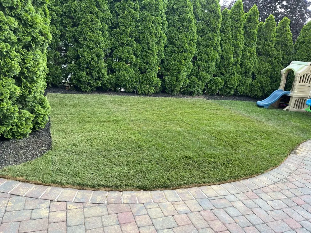 Custom outdoor landscaping with custom design in Deer Park, NY by Gem landscaping