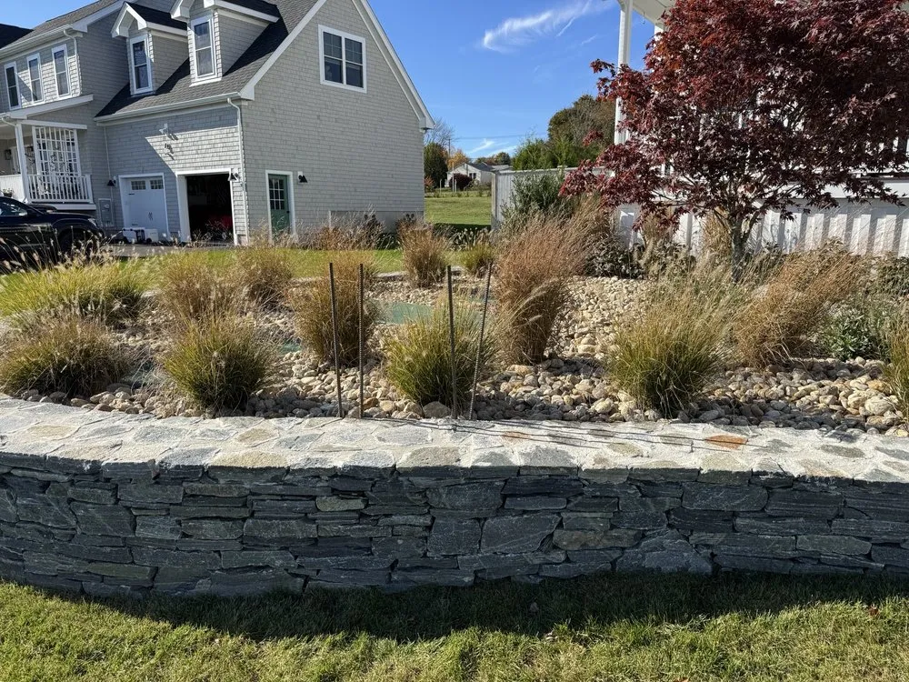 Trusted lawn care service for residential properties in Fall River, MA by Genos Landscaping