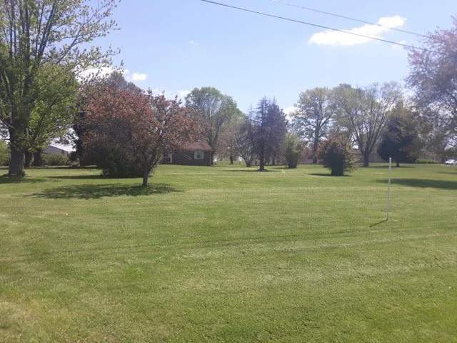 Affordable landscape design for year-round maintenance in Woodburn, KY by Get R Done Lawn Care And More