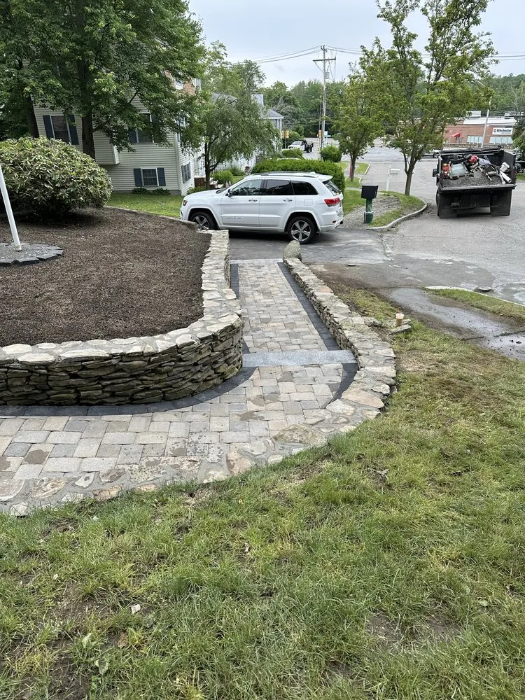 Affordable lawn mowing service for residential properties in Lynn, MA by Gilmar & Son