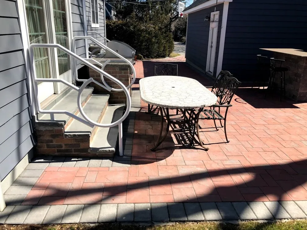 Affordable landscape installation with custom design in Glen Head, NY by Gioino Joseph & Sons