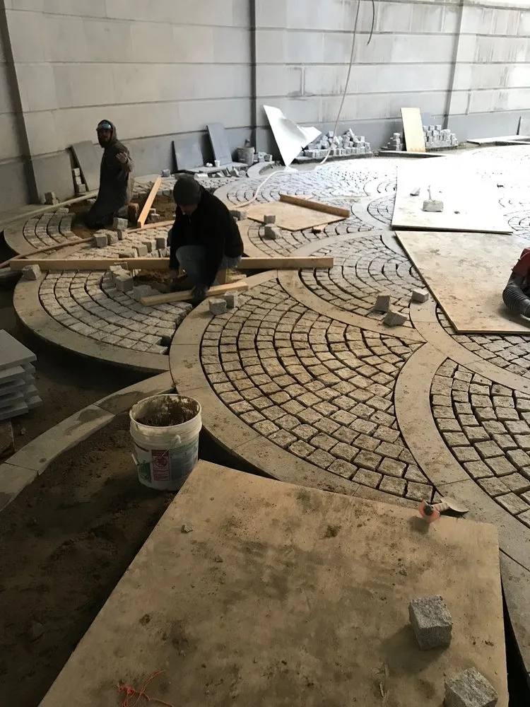 Custom yard maintenance for residential properties in Island Park, NY by G&M Landscape Construction