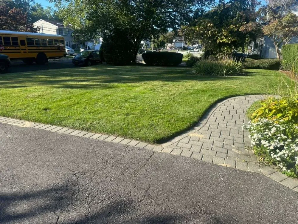 Local lawn care service for residential properties in Coram, NY by GOE Services