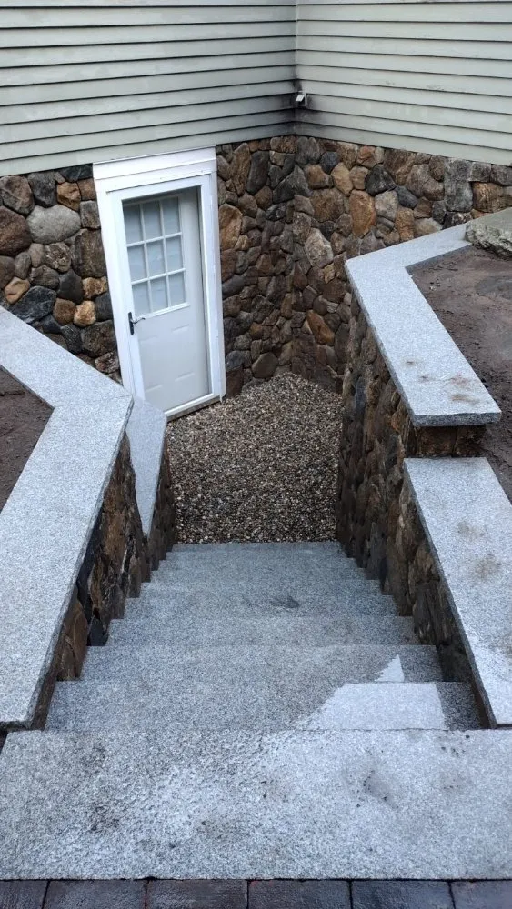 Custom residential landscaping for year-round maintenance in Marlborough, MA by Golden Hill Landscape And Construction