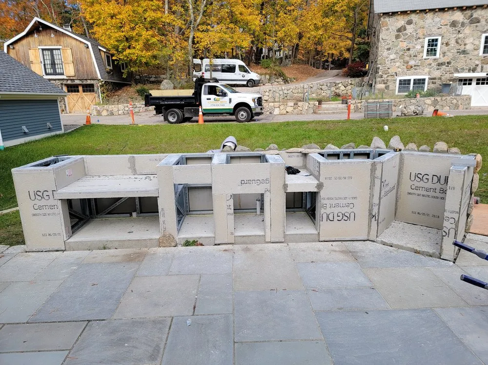 Professional landscaping services for residential properties in Abington, MA by Golden Way Construction And Landscaping Corp