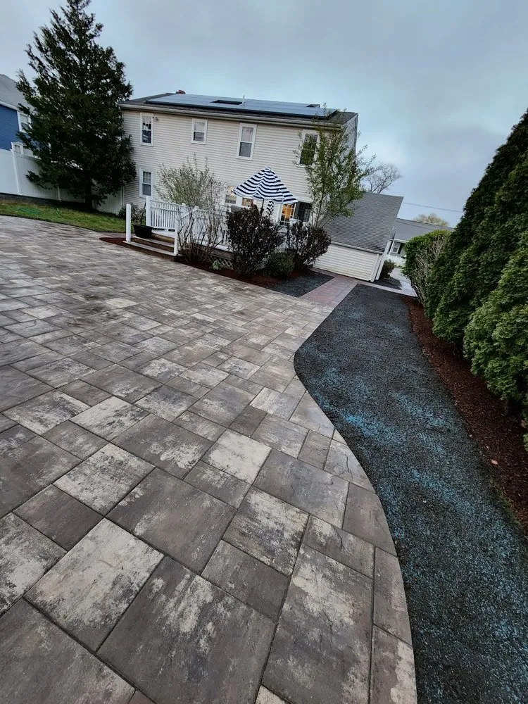 Custom landscape design for year-round maintenance in Abington, MA by Golden Way Construction And Landscaping Corp