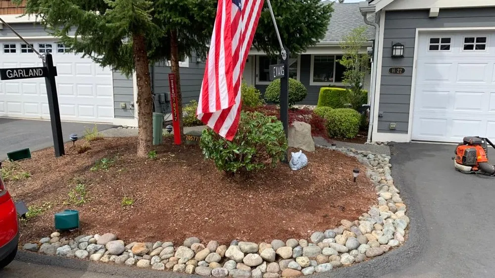 Expert outdoor landscaping with custom design in Belfair, WA by Gomez Lawn Care Services and Maintenance